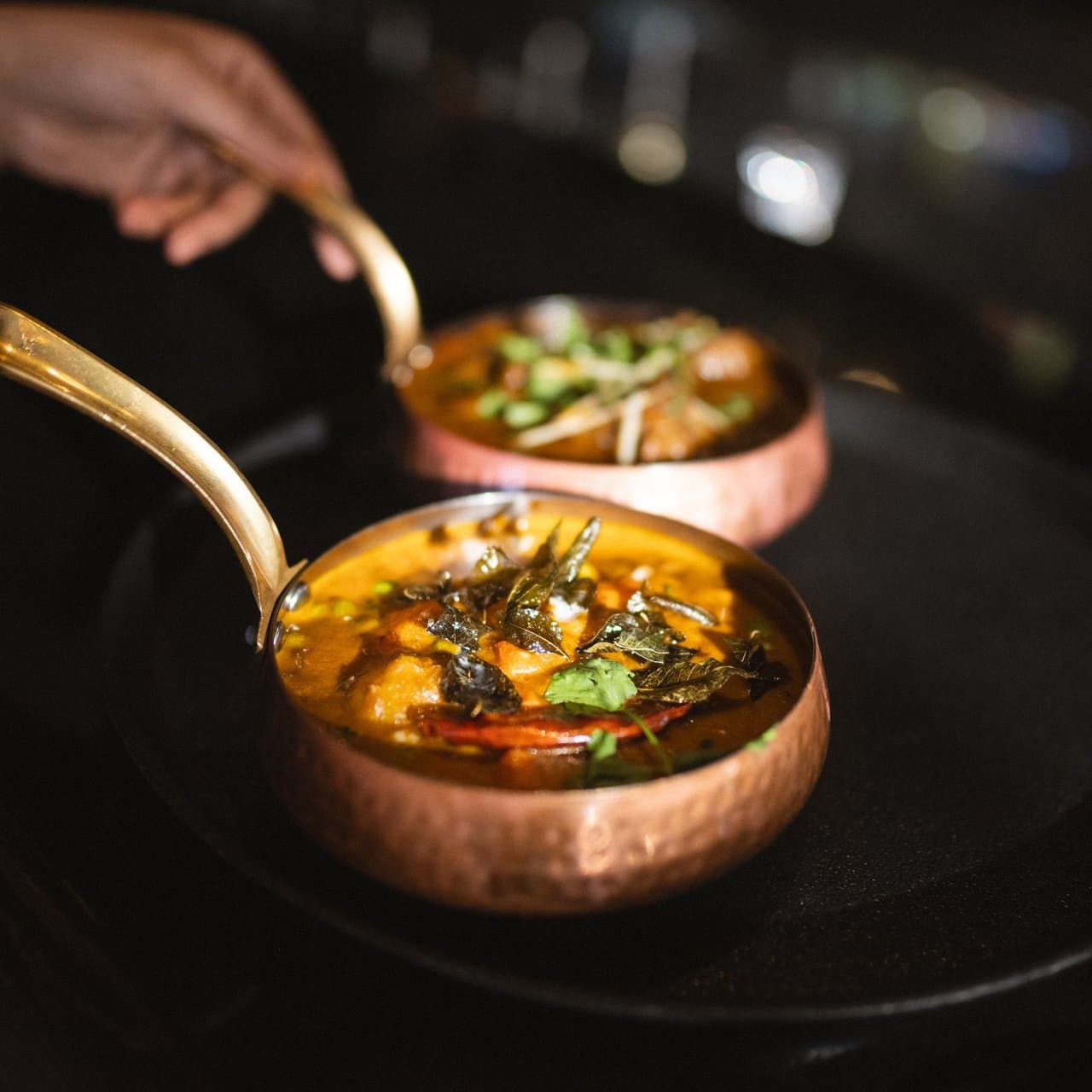 A-curry-dish-in-a-copper-serving-pot-at-Showshaa-Modern-Taproom-in-Surrey-BC-Ian-Harland-DSC_7146-Edit__FocusFillMaxWyItMC4xMSIsIjAuNDAiLDE5MjAsMTkyMF0.jpg